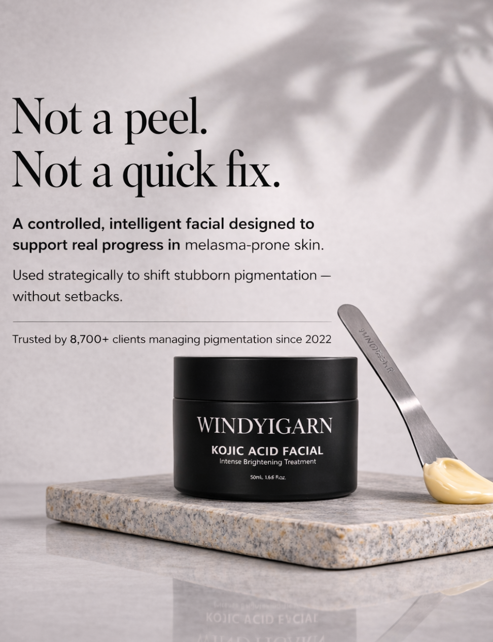Windygarn Kojic Acid Facial product on a marble surface with text about its benefits.