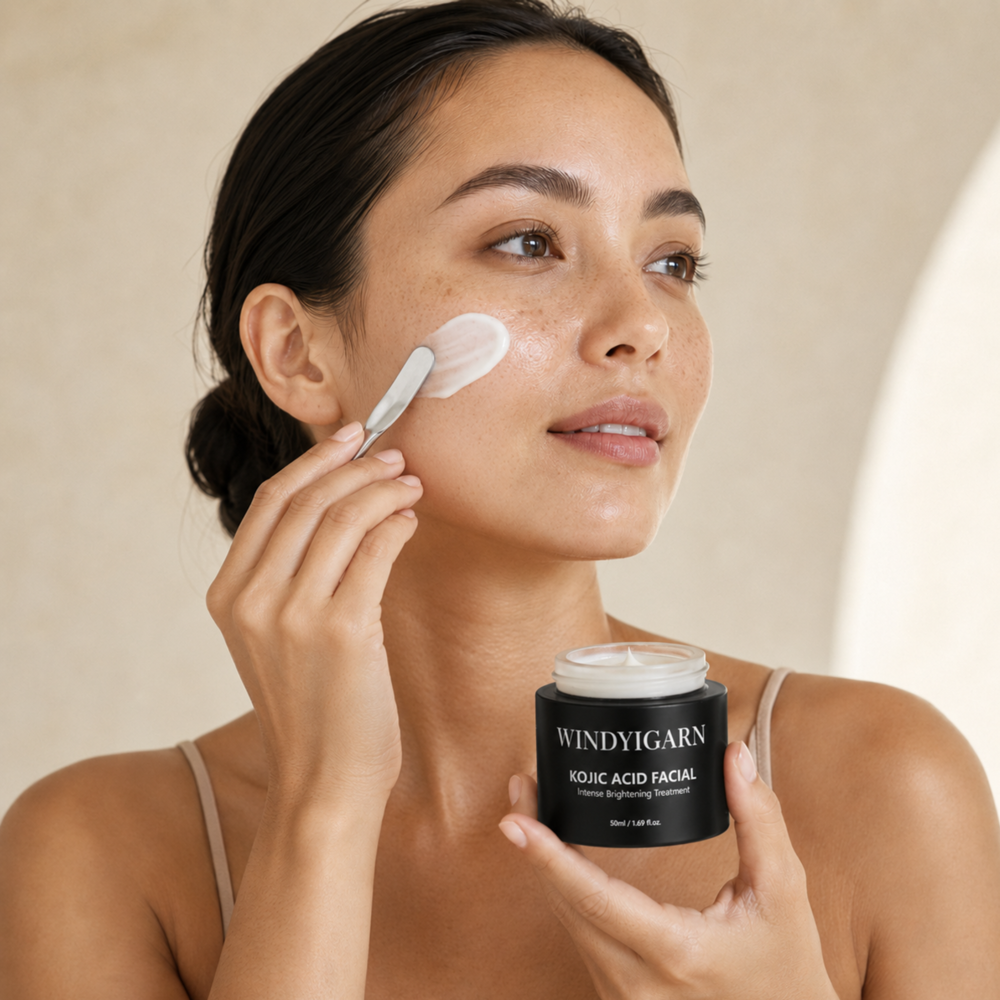 Woman applying the Kojic Acid Facial with a clean spatula